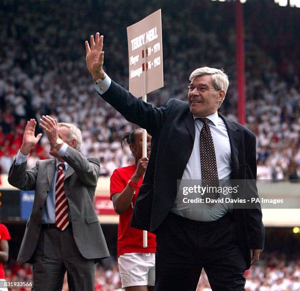 Former Arsenal player Malcolm MacDonald takes part in a lap of the pitch