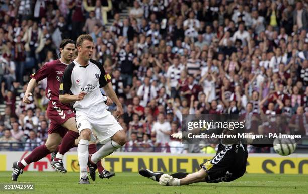 Gretna's Ryan McGuffie scores against Hearts during the Tennents Scottish Cup final at Hampden Park, Glasgow.