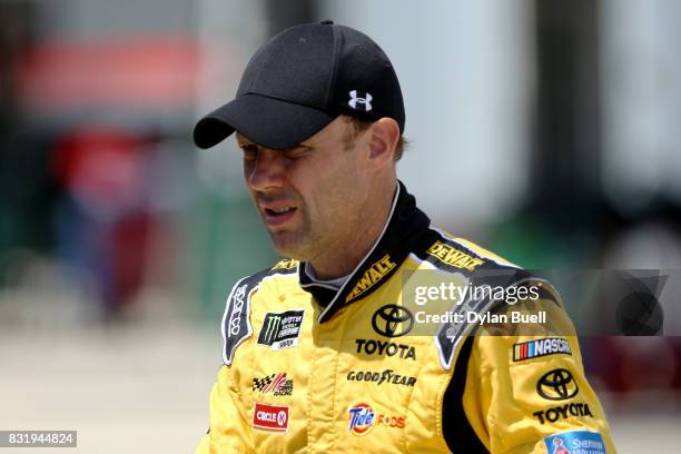 Matt Kenseth, driver of the DEWALT Flexvolt Toyota, walks to the garage during testing for the Monster Energy NASCAR Cup Series at Chicagoland...