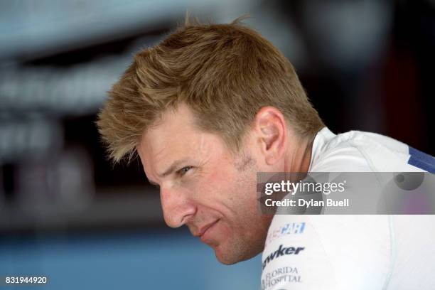 Jamie McMurray, driver of the McDonalds/Cessna Chevrolet, looks on during testing for the Monster Energy NASCAR Cup Series at Chicagoland Speedway on...