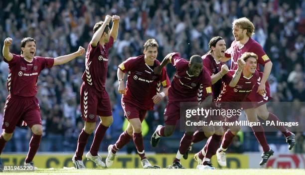 Hearts players celebrate after winning the Tennents Scottish Cup final against Gretna at Hampden Park, Glasgow.