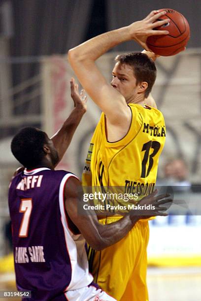 Hanno Mottola number 13 of Aris TT Bank and Alain Koffi number 7 of Le Mans in action during the Euroleague Basketball Game 9 between Aris TT Bank...