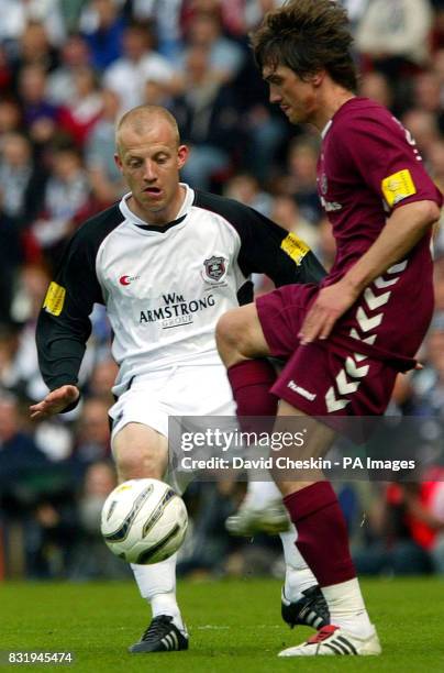 Gretna's Gavin Skelto challenges Heart's Robbie Neilson during the Tennents Scottish Cup final at Hampden Park, Glasgow.