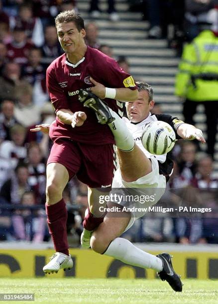 Hearts' Rudi Skacel is challenged by Gretna's David Nicholls during the Tennents Scottish Cup final at Hampden Park, Glasgow.
