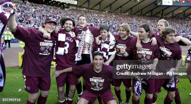Hearts players celebrate with the trophy after the Tennents Scottish Cup final against Gretna at Hampden Park, Glasgow.