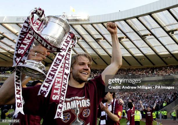 Hearts' Robbie Neilson celebrates with the trophy after the Tennents Scottish Cup final against Gretna at Hampden Park, Glasgow.