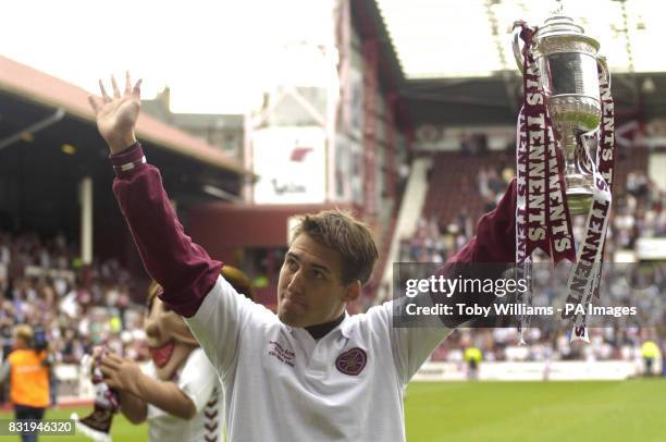 Hearts player Rudi Skacel holds the cup in Tynecastle Stadium after the team paraded through Edinburgh's Royal Mile to celebrate yesterday's victory...