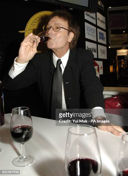 Sir Cliff Richard hosts a tasting at the exhibition of wine from his very own vineyard during the International Wine Challenge at the EXcel centre,...
