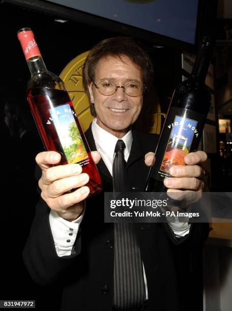 Sir Cliff Richard hosts a tasting at the exhibition of wine from his very own vineyard during the International Wine Challenge at the EXcel centre,...