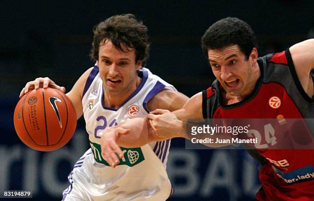 Ra?l Lopez of Real Madrid and Mark Dickel of Brose Baskets in action during the Euroleague Basketball Game 10 between Real Madrid and Brose Baskets...