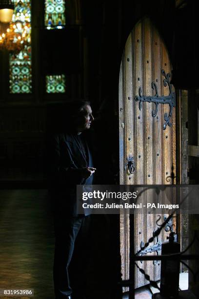 One of the priests looks out the door waiting for the media to arrive on Day 5 of the Afghan Refugee Hunger Strike in St. Patricks Cathedral in...