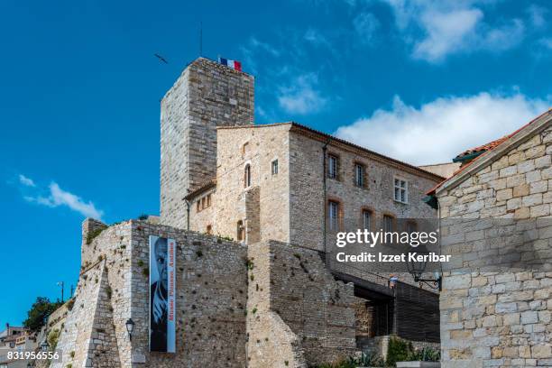 the picasso museum and medieval tower inside (grimaldi palace) at antibes, alpes maritimesi france - antibes ストックフォトと画像