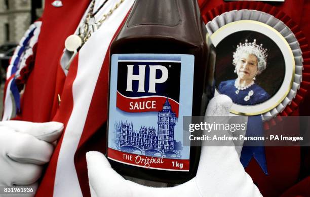 Man dressed as John Bull joins protesters outside Parliament Square in central London to oppose the proposed closure of HP Birmingham factory.