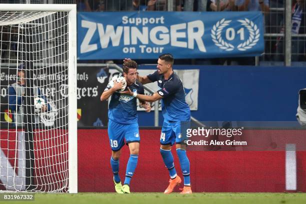 Mark Uth of Hoffenheim celebrates his goal with Sandro Wagner of Hoffenheim during the UEFA Champions League Qualifying Play-Offs Round First Leg...
