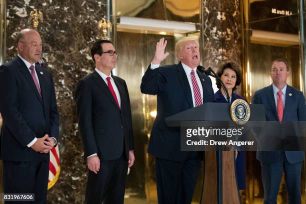 President Donald Trump delivers remarks following a meeting on infrastructure at Trump Tower, August 15, 2017 in New York City. Standing alongside...