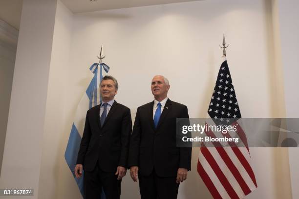 Mauricio Macri, Argentina's president, left, stands with U.S. Vice President Mike Pence during a meeting at the presidential residence in Olivos,...