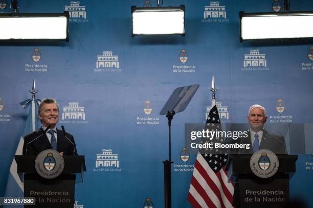 Mauricio Macri, Argentina's president, left, speaks while U.S. Vice President Mike Pence listens during a joint press conference in Buenos Aires,...