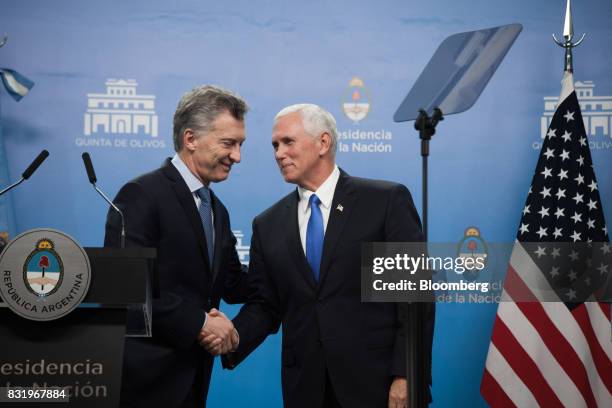 Mauricio Macri, Argentina's president, left, shakes hands with U.S. Vice President Mike Pence during a joint press conference in Buenos Aires,...