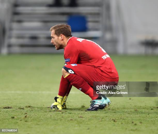Oliver Baumann of Hoffenheim on his knees during the UEFA Champions League Qualifying Play-Offs Round First Leg match between 1899 Hoffenheim and...