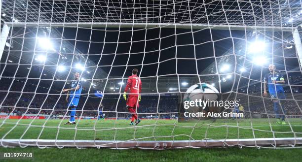 James Milner scores while Oliver Baumann, Lukas Rupp and KEvni Vogt of Hoffenheim look on during the UEFA Champions League Qualifying Play-Offs Round...