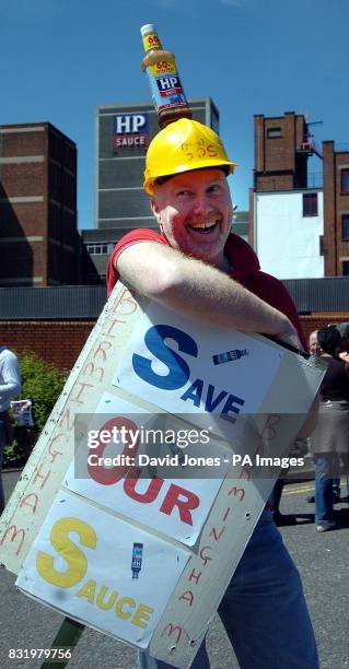 Steve Burris of Winson Green with appropriate headgear outside Birmingham's HP Sauce factory on a protest march today as part of a campaign to save...