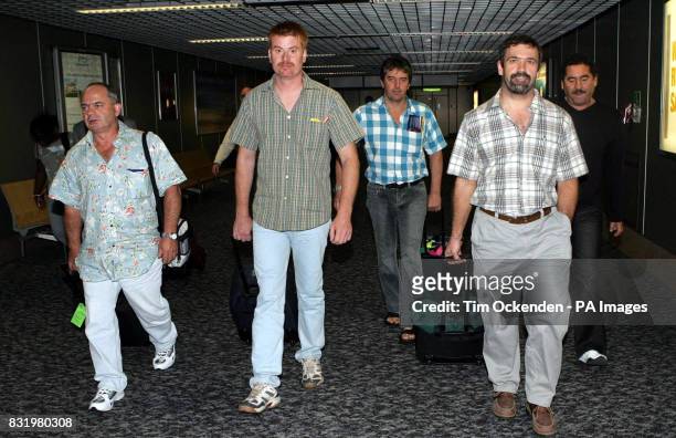 Some of the six oil workers kidnapped in Nigeria John Stewart, Phil Morris, Ian Metcalf, Peter Vermenlin and an unnamed man arrive back at Heathrow...