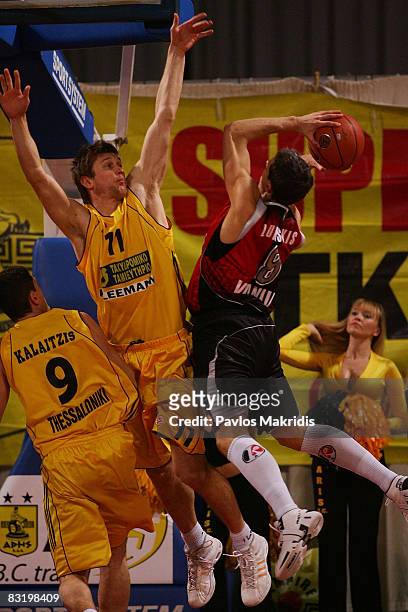 Kalaitzis Georgios number 9 and Boisa Vladimer number 11 of Aris TT Bank and Lukauskis Mindaugas number 8 in action during the Euroleague Basketball...