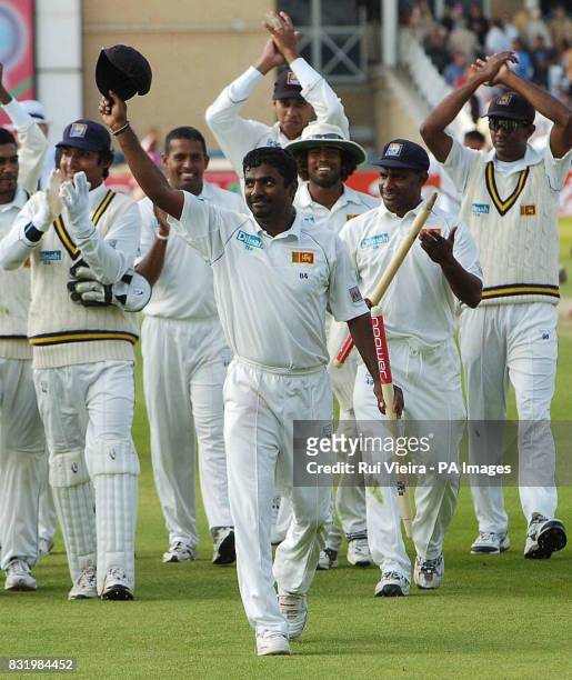 Sri Lanka's Muttiah Muralitharan leads his sides celebrations after defeating England and taking 8 wickets during the fourth day of the third npower...