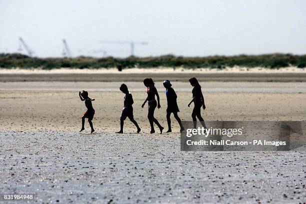Children playing on Dublin city's only Blue flag beach, Dollymount Strand - as Ireland's beaches have received their largest ever number of blue...