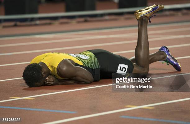 16th IAAF World Championships: Jamaica Usain Bolt down on track with injury during Men's 4X100M Final race at Olympic Stadium. Sequence. London,...