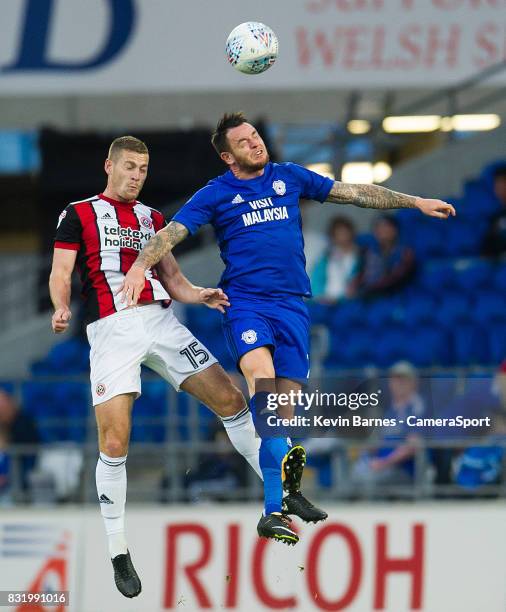 Cardiff City's Lee Tomlin vies for possession with Sheffield United's Paul Coutts during the Sky Bet Championship match between Cardiff City and...