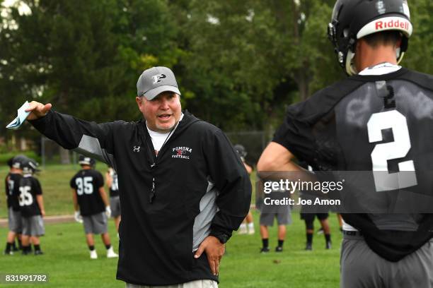 Pomona head coach Jay Madden talking to his quarterback Ryan Marquez during their practice at Pomona high school in Arvada. August 14, 2017 Arvada,...