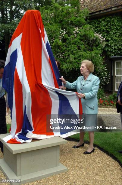 Lady Thatcher unveils a statue of World War One poet Rupert Brooke at Lord Archer's home in Grantchester, near Cambridge.