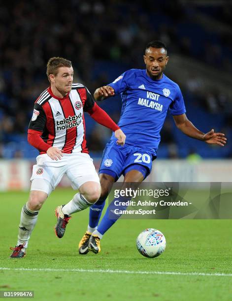 Sheffield United's John Fleck battles with Cardiff City's Loic Damour during the Sky Bet Championship match between Cardiff City and Sheffield United...