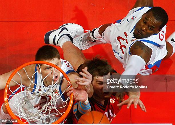 Of TAU Ceramica, Tiago Splitter, #31 of CSKA Moscow, Victor Khryapa and Marcus Goree in action during the Euroleague Basketball Final Four game...