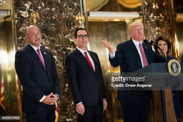 President Donald Trump delivers remarks following a meeting on infrastructure at Trump Tower, August 15, 2017 in New York City. Standing alongside...