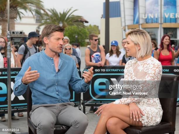 Nikolaj Coster-Waldau and Charissa Thompson visit "Extra" at Universal Studios Hollywood on August 15, 2017 in Universal City, California.