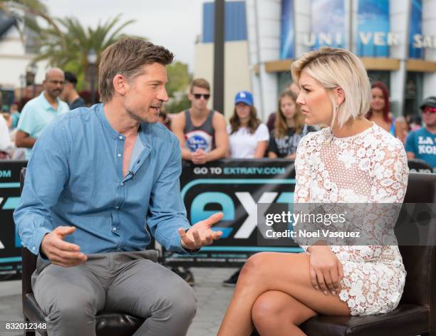 Nikolaj Coster-Waldau and Charissa Thompson visit "Extra" at Universal Studios Hollywood on August 15, 2017 in Universal City, California.