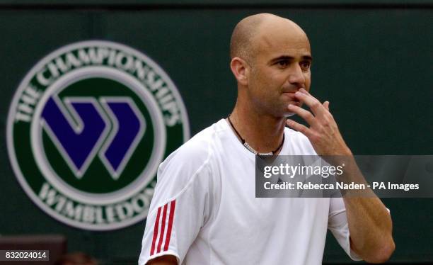 S Andre Agassi in action against Serbia and Montenegro's Boris Pashanski during the first round of The All England Lawn Tennis Championships at...