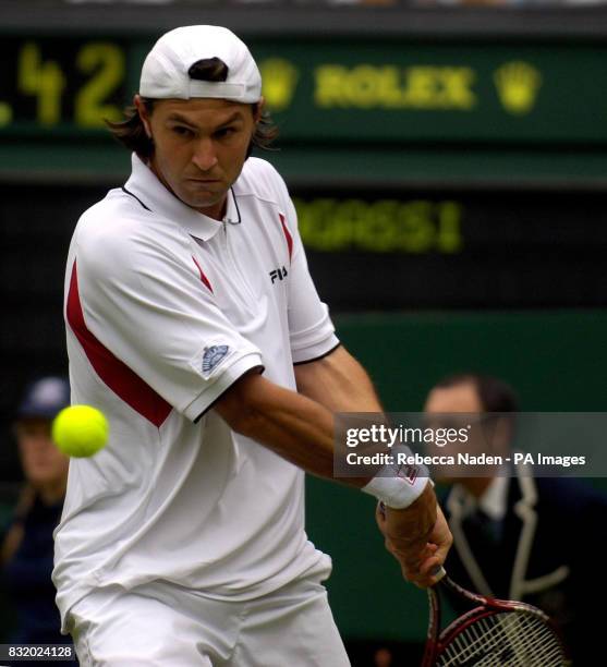 Serbia and Montenegro's Boris Pashanski in action against USA's Andre Agassi during the first round of The All England Lawn Tennis Championships at...