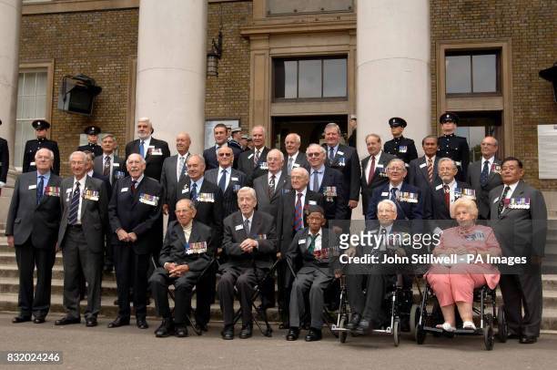 Victoria Cross and George Cross holders pose for a family photo outside the Imperial War Museum in south London : John Bridge GC, Kenneth Farrow GC,...