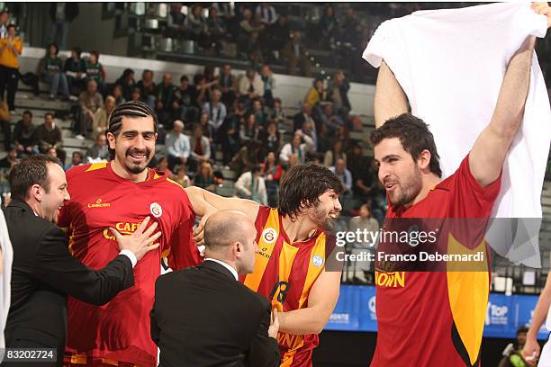 Fatih Solak, #11, Cenk Akyol, #18 and Mutrat Kaya, #10 of Galatasaray reacts after his victory at the end of their ULEB Cup Final 8 Quarterfinal Game...