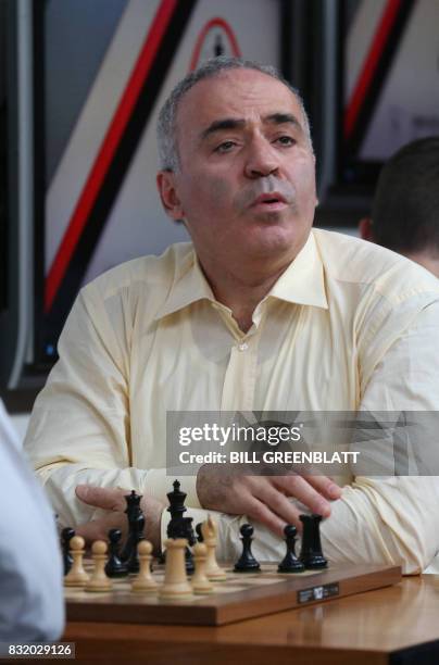 Grandmaster chess player Garry Kasparov looks to the group of onlookers during a match against grandmaster Levon Aronian on day two of the Grand...