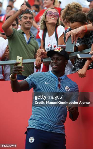 Benjamin Mendy of Manchester City takes a selfie photograph with fans during the pre-season friendly match between Girona and Manchester City at...