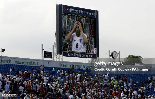 England cricket fans watch Frank Lampard miss his penalty after the One Day International match between England and Germany at Headingley, Leeds.