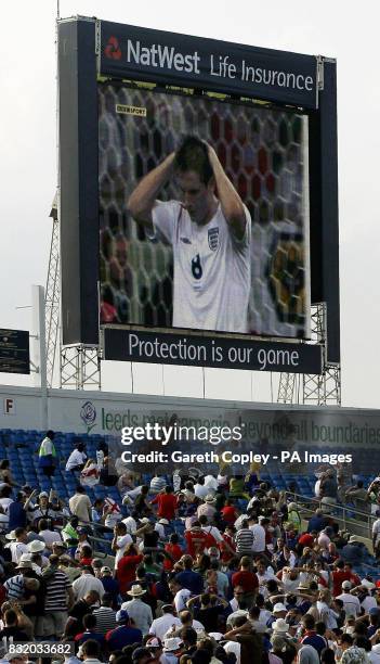 England cricket fans watch Frank Lampard miss his penalty after the One Day International match between England and Germany at Headingley, Leeds.