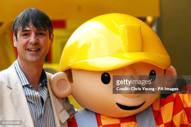 Actor Neil Morrissey greets Bob The Builder, the character that he voices, at the UK premiere of Bob the Builder: Built To Be Wild, in Leicester...