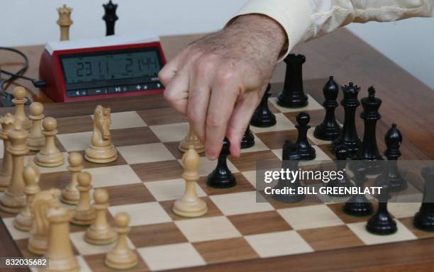 Grandmaster chess player Garry Kasparov makes a move against grandmaster Levon Aronian during day two of the Grand Chess Tour at the Chess Club and...