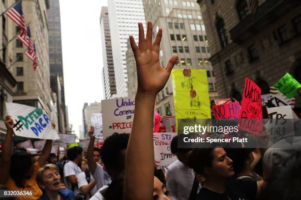 Dozens of immigration advocates and supporters attend a rally outside of Trump Tower along Fifth Avenue on August 15, 2017 in New York City. The...