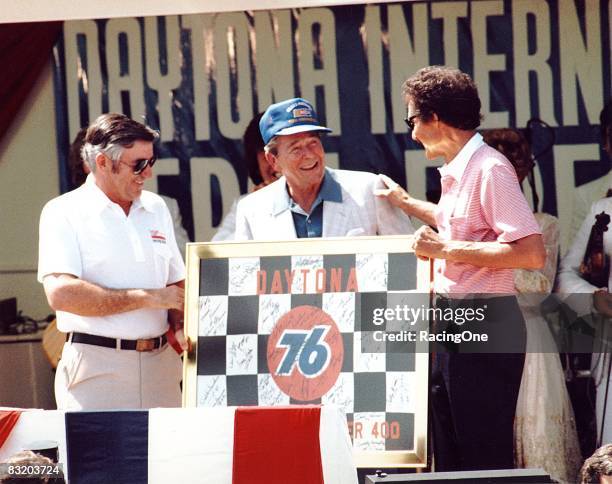 President Ronald Reagan with Richard Petty at the 1984 Firecracker 400 at Daytona. Bobby Allison looks on.